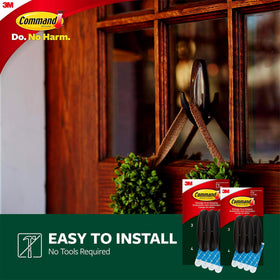 Door decoration with thermometer using Command Bronze Hooks for outdoor display
