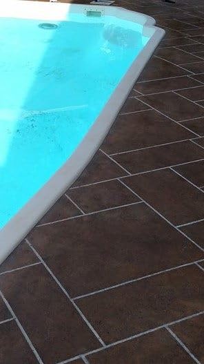 Stain being applied to concrete to illustrate color flow and texture potential