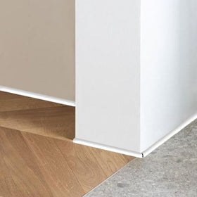 Conwang edge trim applied to columns and walls for a refined perimeter detail.