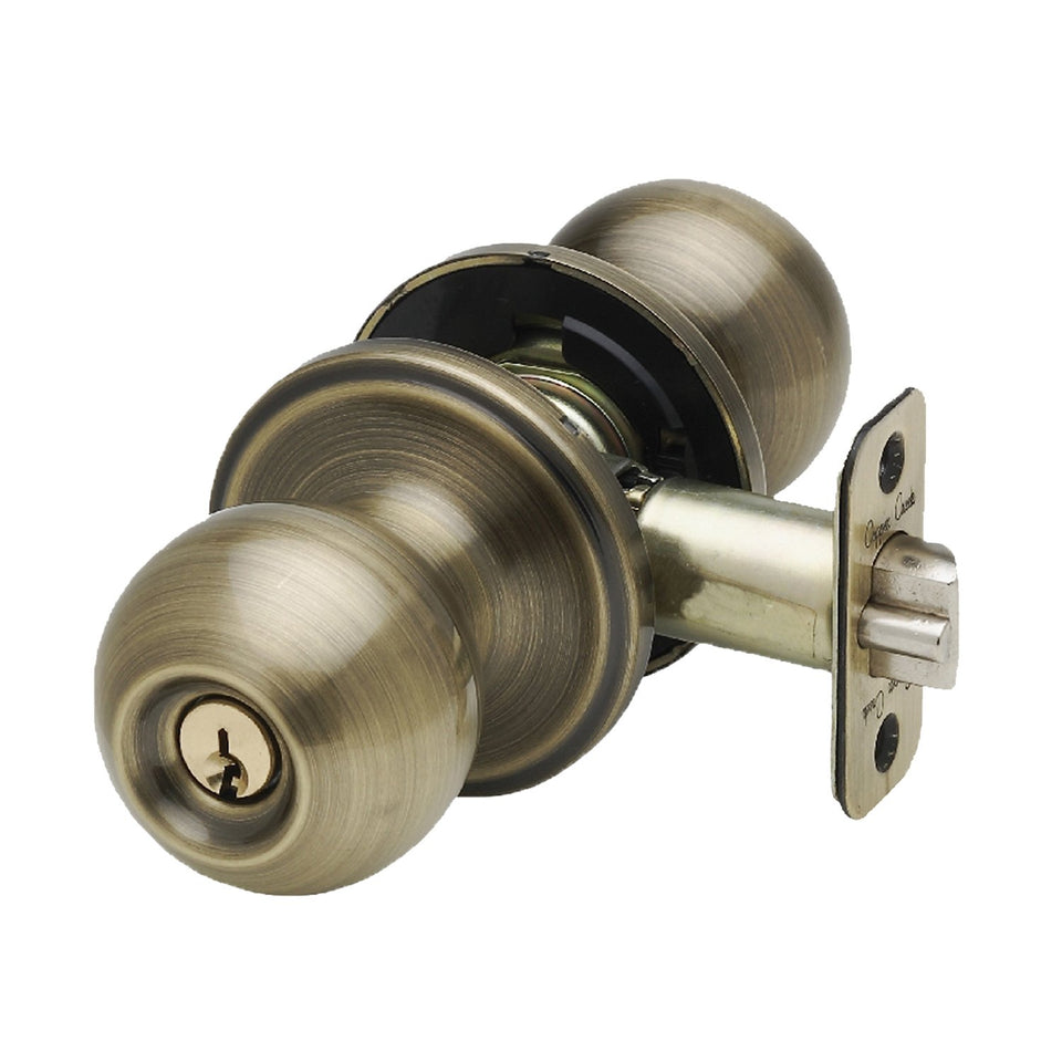 Copper Creek BK2040AB ball door knob in antique brass packaging, ready for installation.