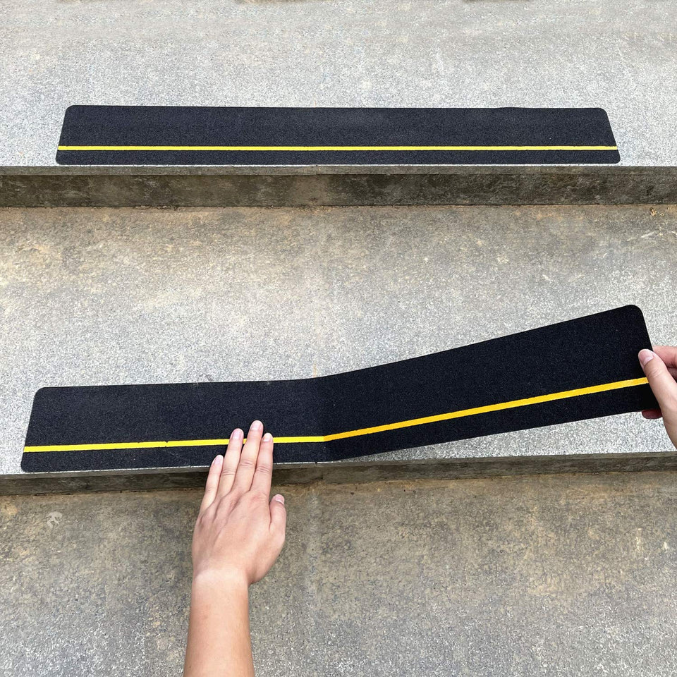COSIMIXO anti-slip stair tread with yellow reflective strip on stairs improves footing.