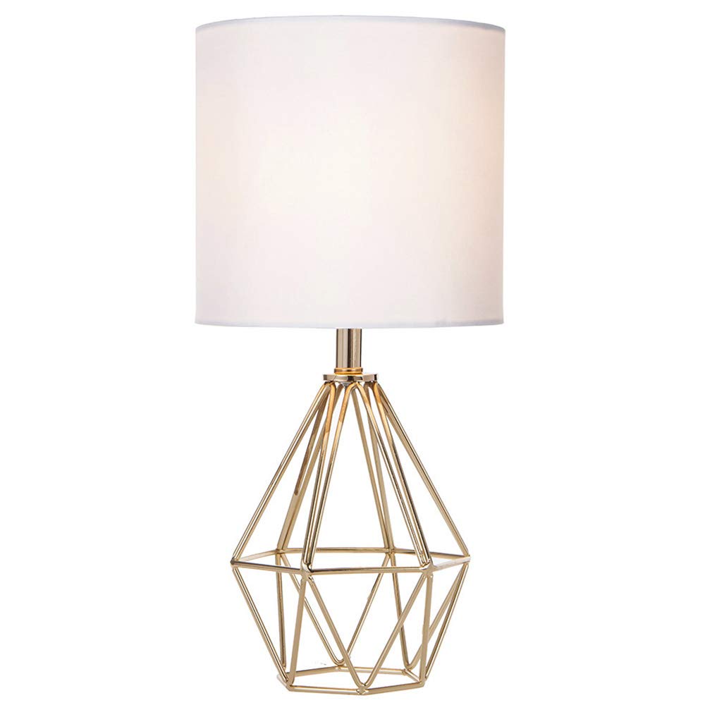 Cotulin gold modern hollow base lamp on a nightstand for stylish ambience