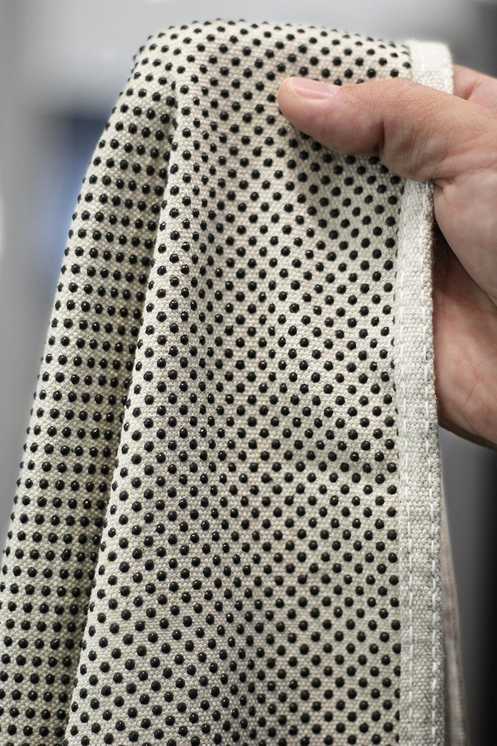 CoverGrip drop cloth close-up showing rubberized dots gripping the surface