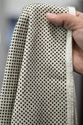 CoverGrip drop cloth close-up showing rubberized dots gripping the surface