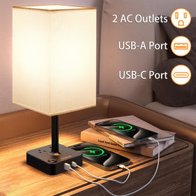cozoo bedside lamp in white fabric shade provides soft, eye-friendly lighting for reading.
