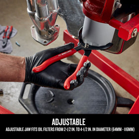 Craftsman oil filter pliers gripping stubborn filters with large rubber-coated handles.
