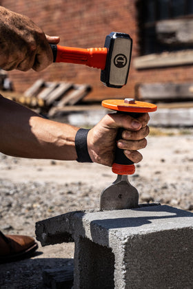 Crescent CBCH30H chiseling brick-work action on a masonry surface.