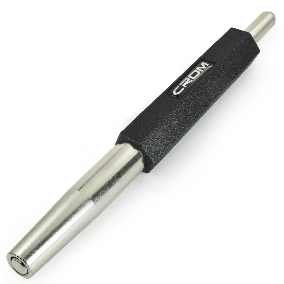 CROM Trim Nail Punch shows finger protection during precise trim nail driving.