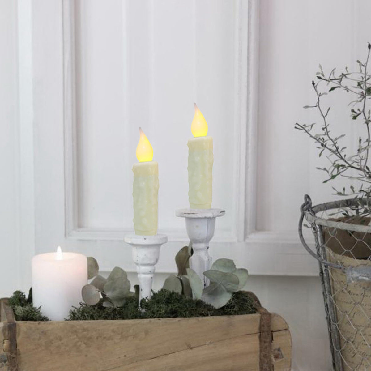 CVHOMEDECO decorative candle glow enhancing a table centerpiece in ivory.