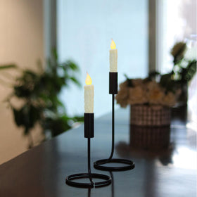 CVHOMEDECO ivory taper shown in a classic candle holder adds elegant lighting.