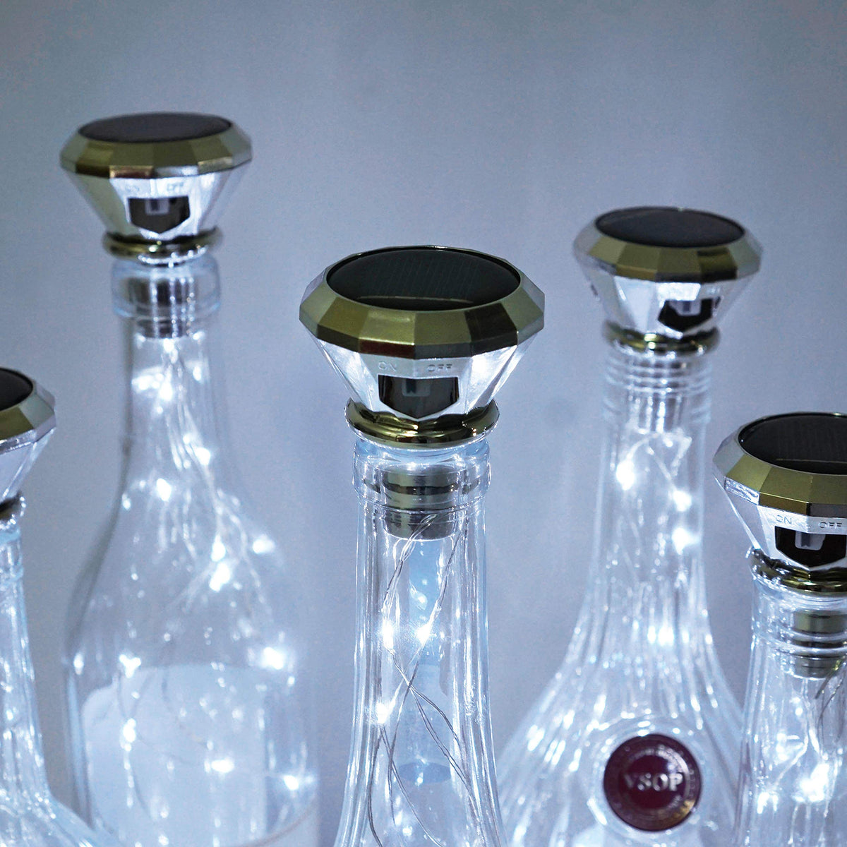 Cynzia solar wine bottle lights cork close-up highlights flexible copper wire for custom shapes.