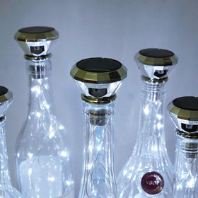 Cynzia solar wine bottle lights cork close-up highlights flexible copper wire for custom shapes.