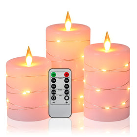 Da by pink flameless candles with string lights for cozy ambiance
