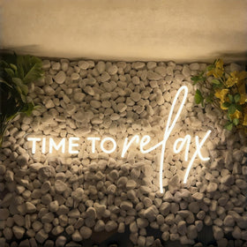 DAKABUKA Time To Relax neon sign with chain for secure wall mounting.