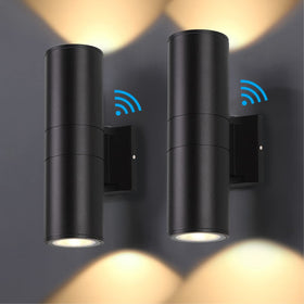 DAKAFUL Dusk-to-Dawn wall light front view illuminates entryway with warm glow