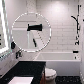 Danco matte black tub spout finish detail emphasizes sleek bathroom update.