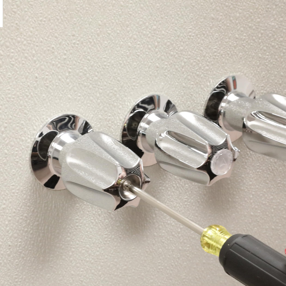 Hot and cold handles with tactile control ready for knob replacement.