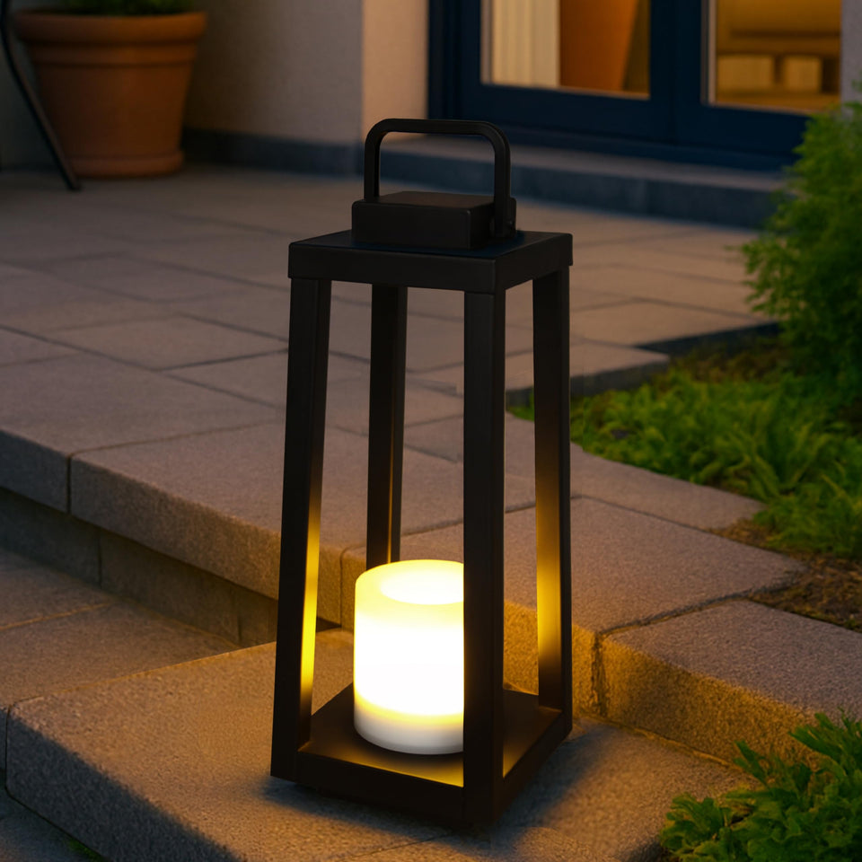 DANCYHOME H16 lantern with black frame glows warmly for outdoor patio ambiance.