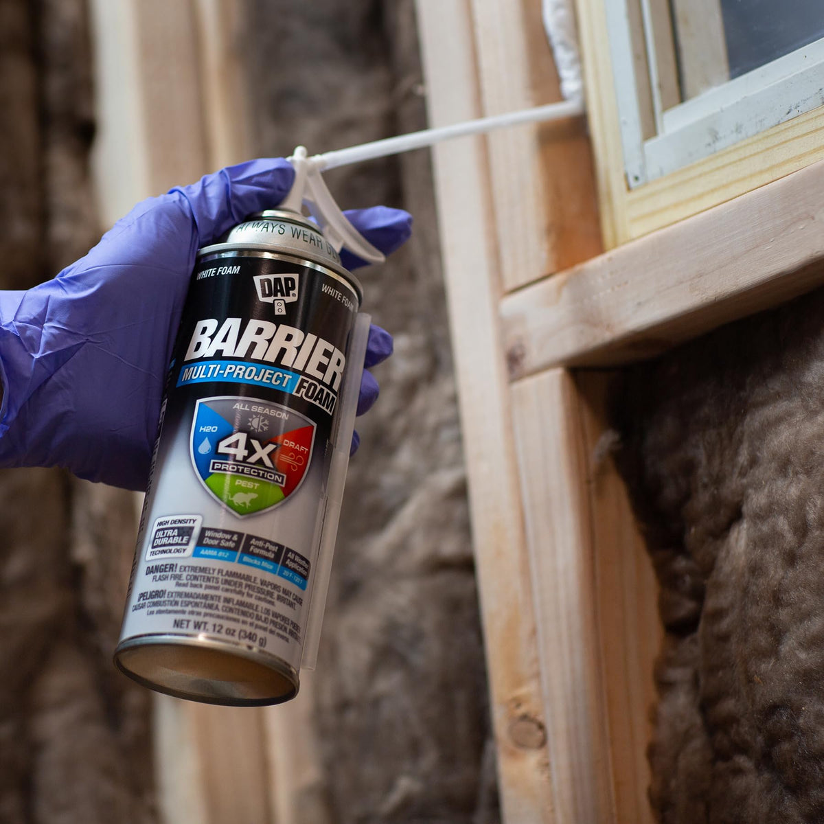 DAP Barrier Foam extension straw shown for precise application in tight gaps.