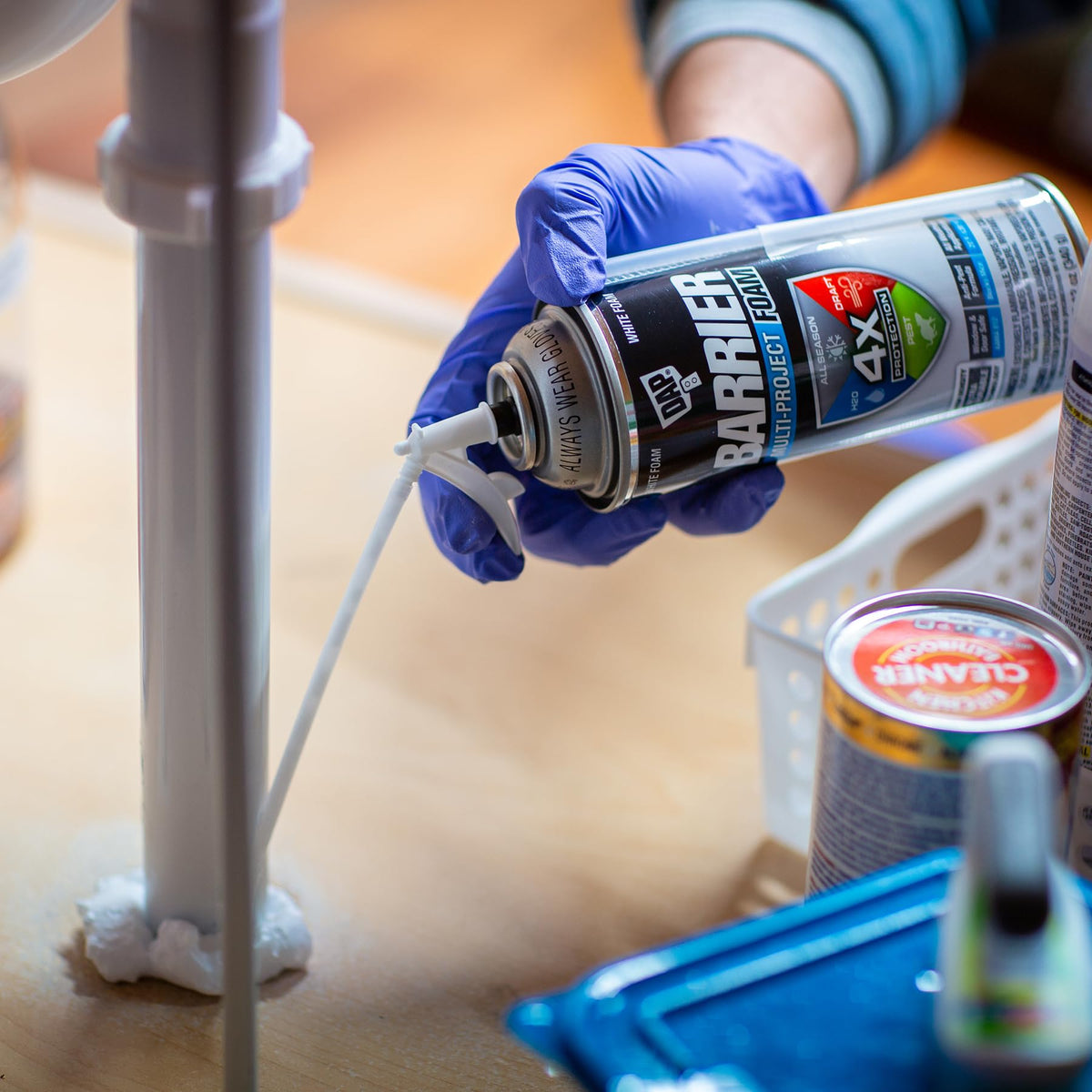 DAP Barrier Foam sealing around windows and doors to reduce drafts and moisture entry.