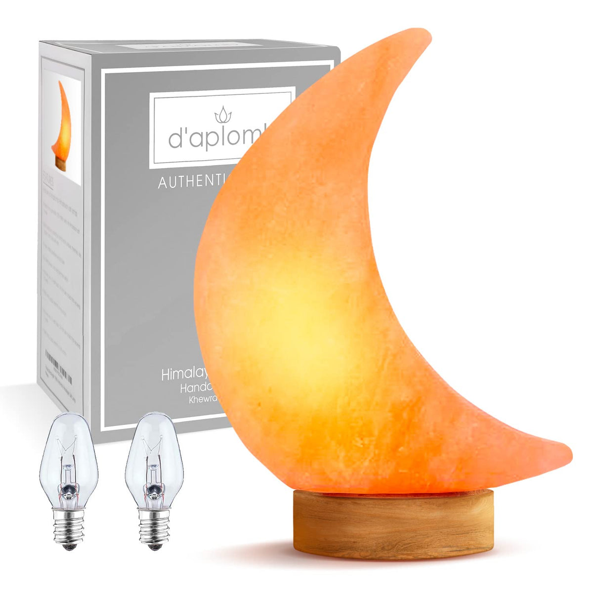 d'aplomb moon pink salt lamp glows softly for calming ambience and atmosphere.