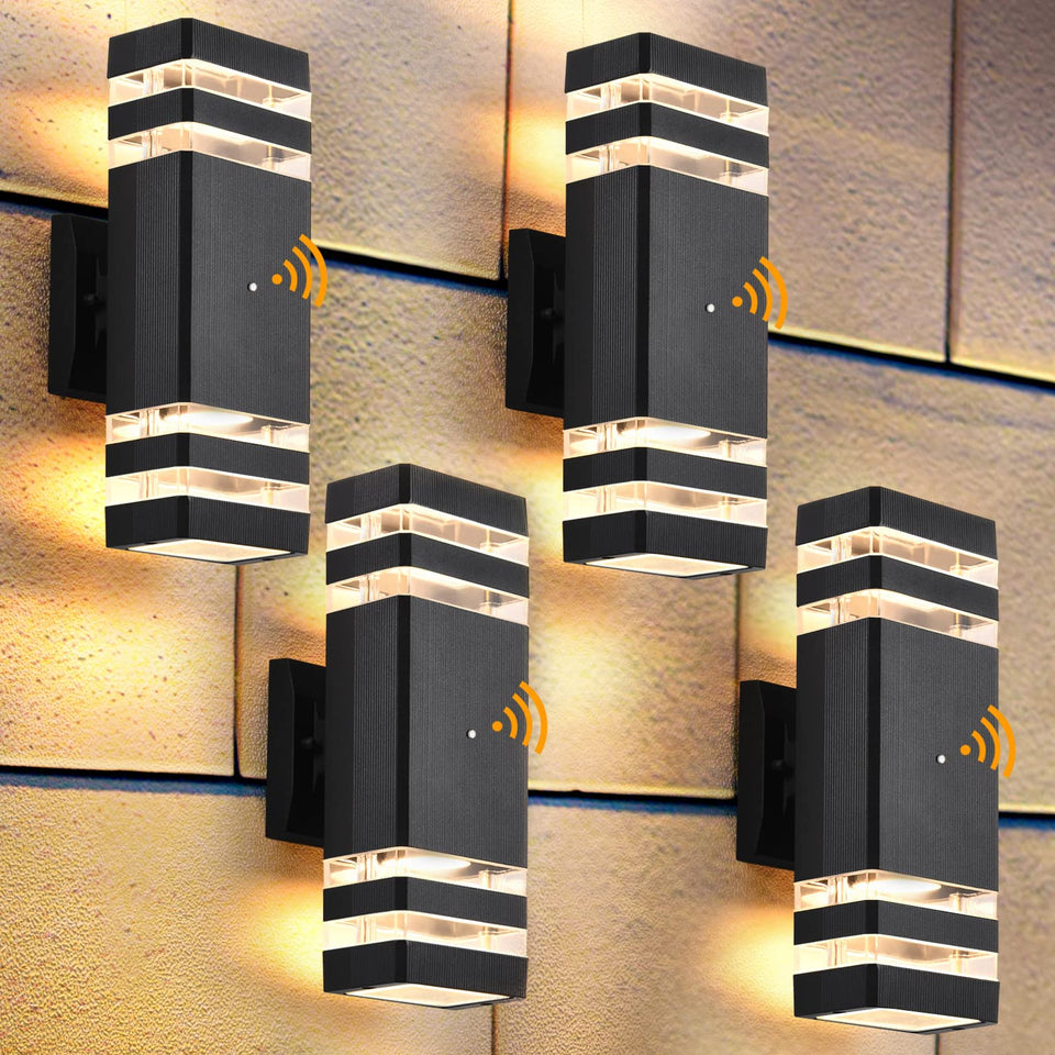 DASTOR dusk-to-dawn outdoor wall light in front view illuminates porches with warm ambiance.