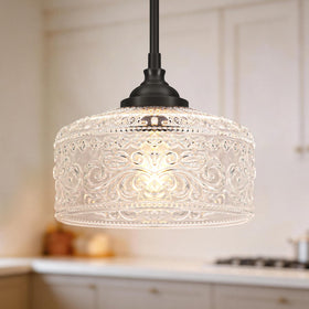 Daunton Black Vintage pendant light with glass shade over a kitchen island for focused task lighting.