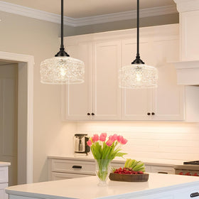 Daunton adjustable-height pendant showcases versatile elevation for tables or countertops.