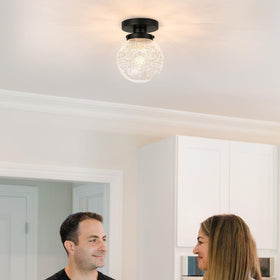 Daunton matte black base ceiling light mounted in a modern hallway