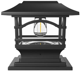 Davinci Lighting Edison solar post cap on a wooden 4x4 post casts warm light along a fence