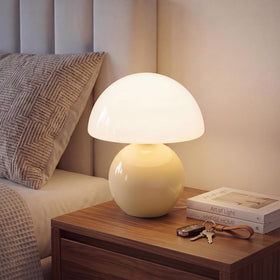 Dawnwake mushroom lamp with cream shade provides cozy ambient lighting.