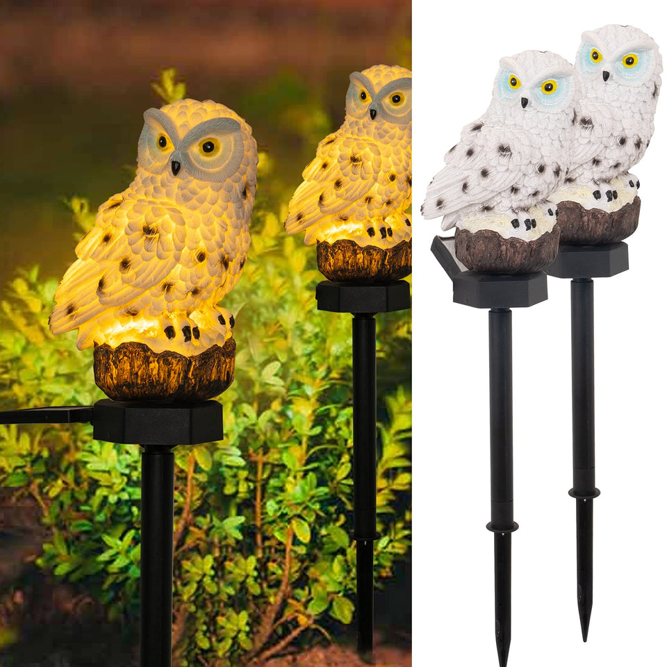 Dazzle Bright owl figure solar light on a stake brightens nighttime garden.