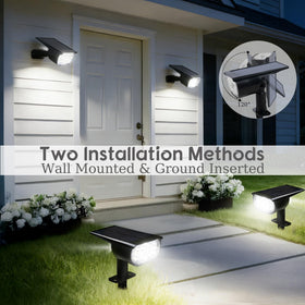 Dazzle Bright solar spot light ground stake installed in lawn for landscape lighting.