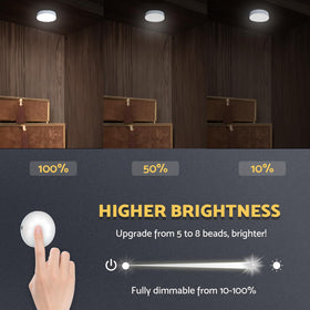 DAZZY DOT touch-control puck light being tapped to turn on
