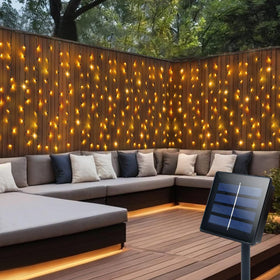 DBFAIRY solar curtain lights brighten the garden setup with a warm white glow for evenings outdoors.