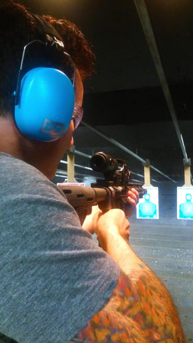 DECIBEL DEFENSE ear muffs support focus in loud environments.