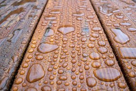 DEFY Extreme cedar-tone stain on railings offers UV resistance and color retention.