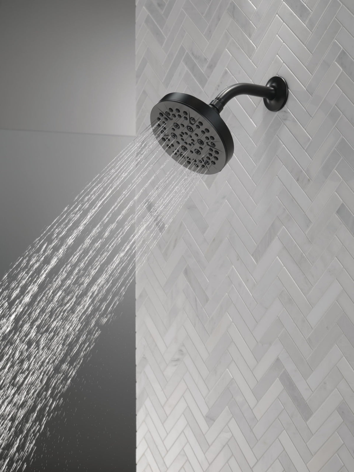 Delta 52535-BL massage spray delivering relaxing, targeted water flow.