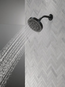 Delta 52535-BL massage spray delivering relaxing, targeted water flow.