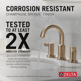 Delta Albion brushed gold faucet handle close-up highlights smooth operation.