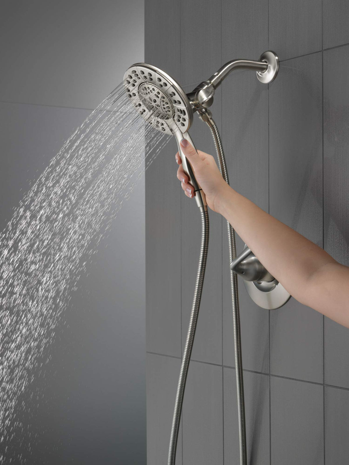 Delta Arvo In2ition 2-in-1 hand shower paired with main shower head for flexible bathing.