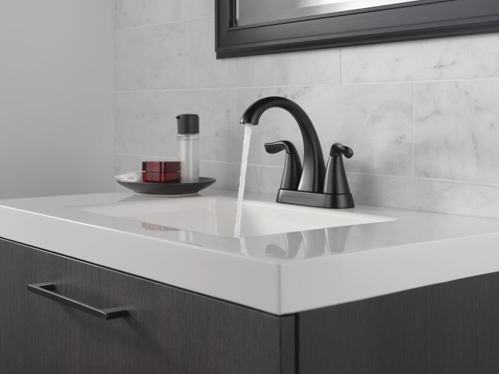 Delta Arvo water flow through the matte black spout with balanced pressure.