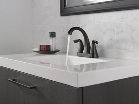 Delta Arvo water flow through the matte black spout with balanced pressure.