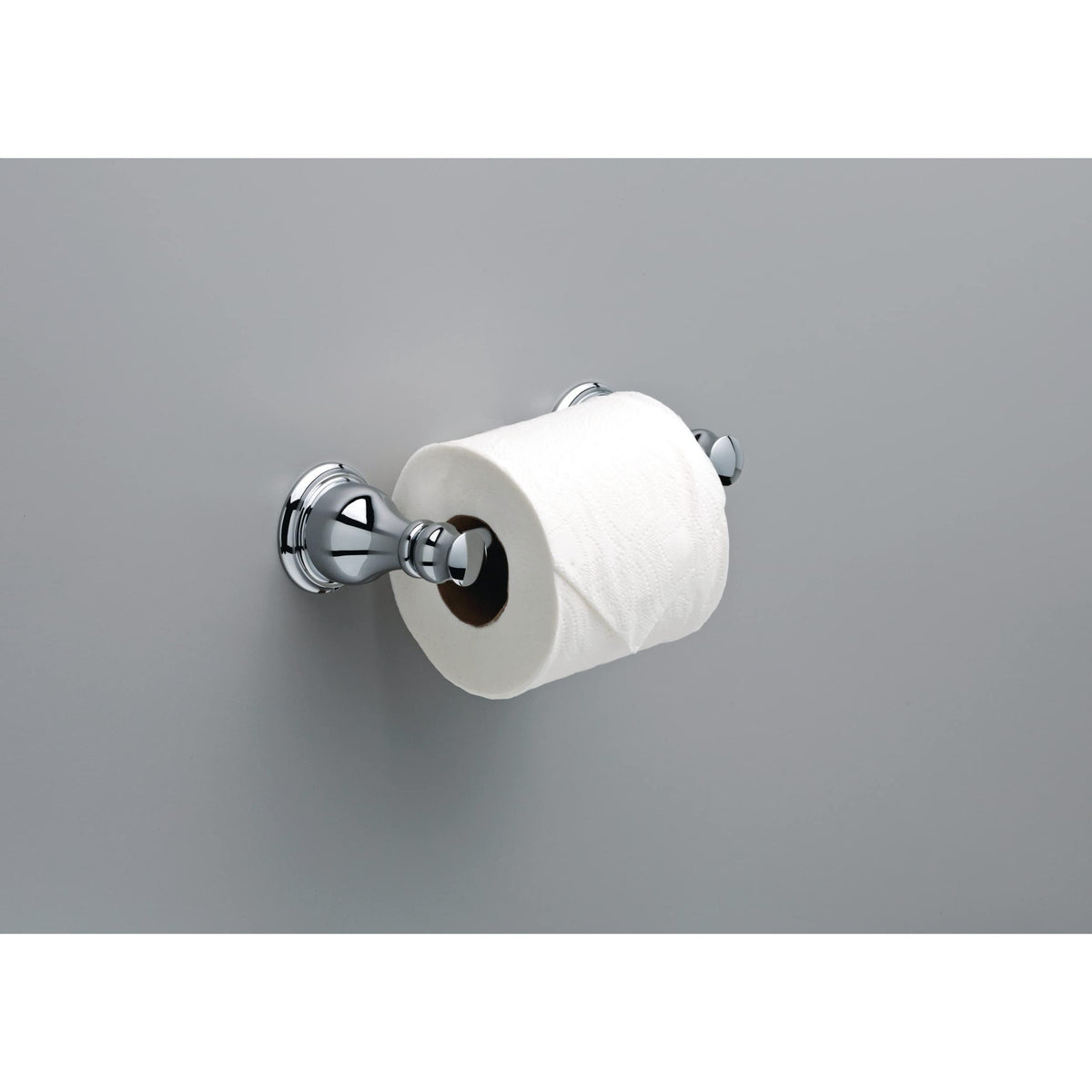 Delta Aubrey pivot-arm toilet paper holder in polished chrome enhances bath style.