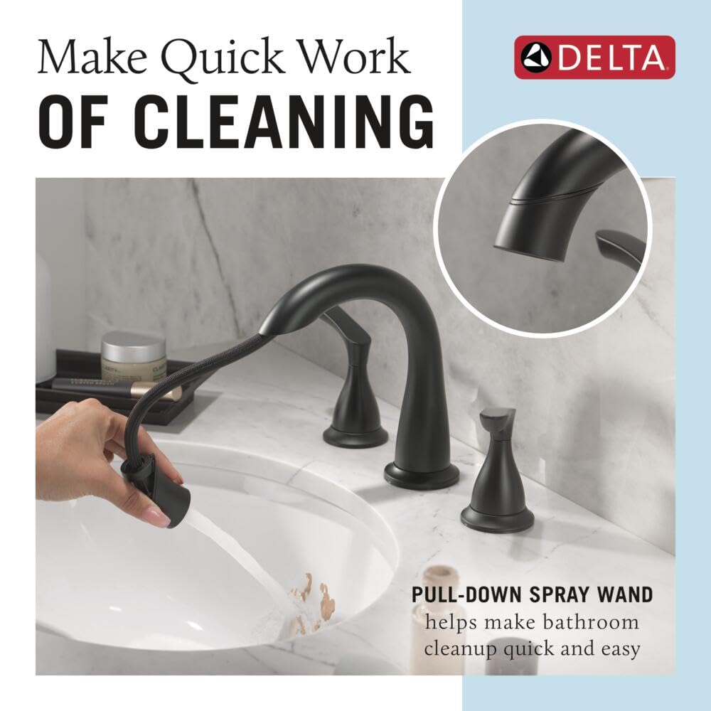 Delta Broadmoor matte black faucet, push-pop drain close-up for easy cleaning.