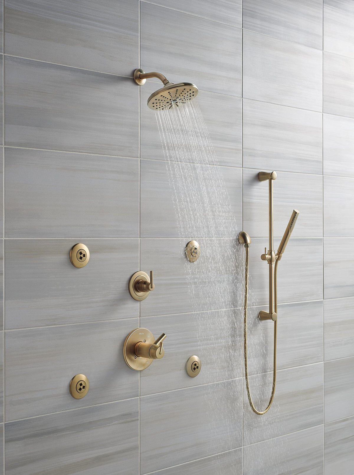 Delta champagne bronze shower elbow contributes to a cohesive, modern bathroom look