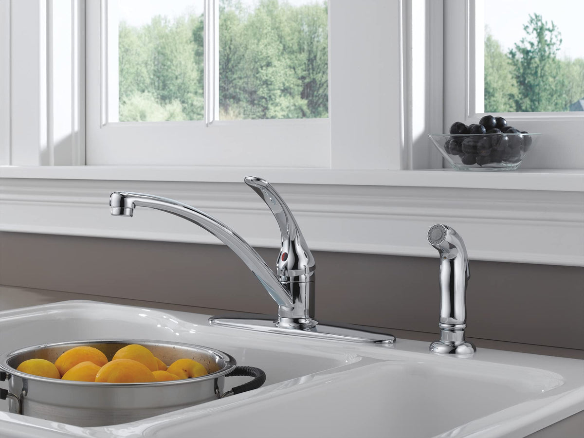 Delta Foundations chrome faucet with side sprayer for efficient rinsing and cleaning