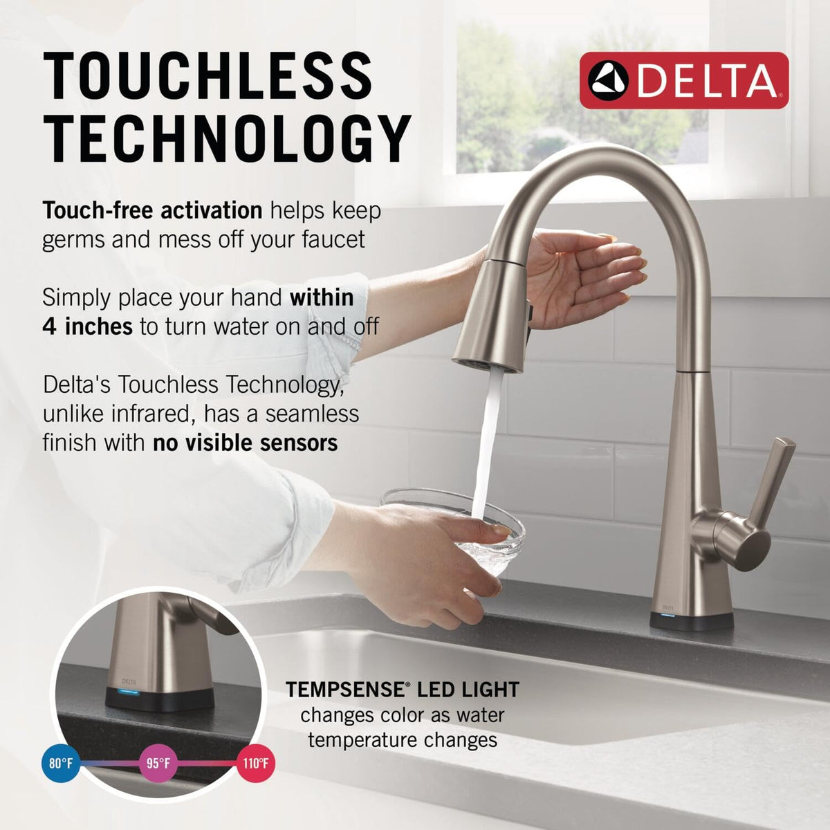 Delta Lenta pull-down sprayer active for easy rinsing and cleaning.