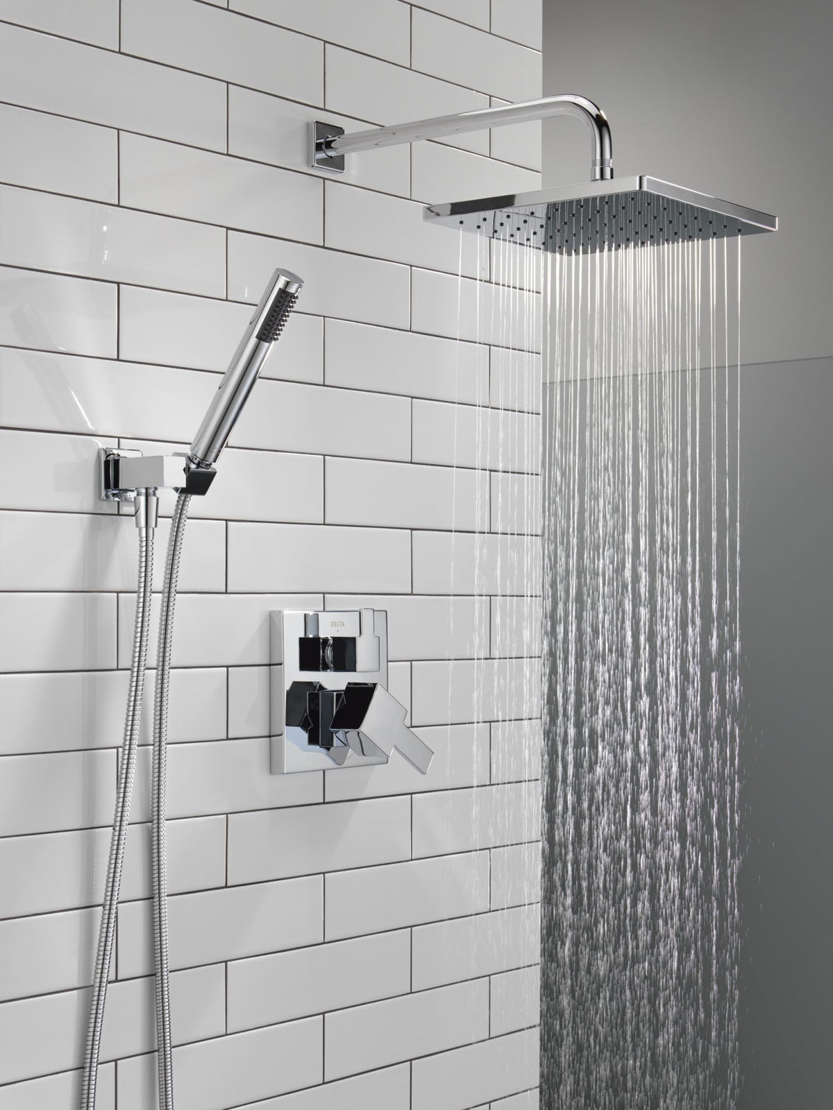 Delta Modern 14 shower arm extends the rain head for broad coverage.