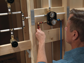 Delta monitor pressure balance valve maintains safe water temperature during showers.